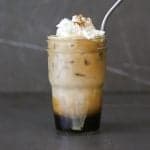 starbucks copycat apple crisp macchiato in a mason jar with a metal straw