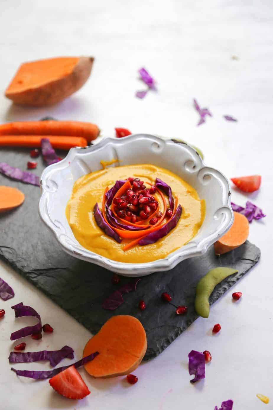 This Curried Carrot Ginger Soup with Sweet Potatoes is spicy, sweet and creamy. Showcasing the best produce fall has to offer and a beautiful color so soup could be better fit for your Thanksgiving table. #glutenfreesoup #vegansoups #carrotsouprecipes #carrotsouphealthy #carrotsoupvegan #vegansoup #glutenfreesoup #carrotrecipes #carrotsoup #carrotgingersoup #soup #vegan #thanksgiving #fallrecipe #clean #glutenfree #detox