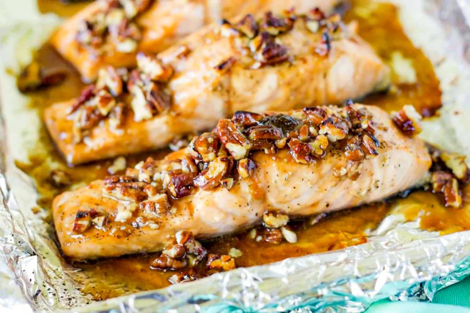 A photo of praline glazed salmon on a sheet pan.