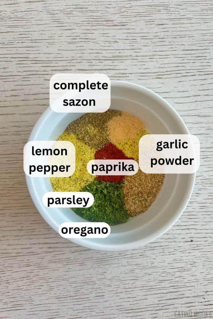 ingredients for Mediterranean spice blend complete sazon, garlic powder, lemon pepper, parsley, oregano, and paprika. 